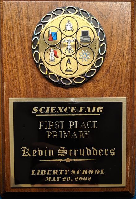 Kevin Scrudders with his first-place science fair project