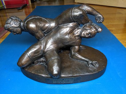 Kevin Scrudders receiving the Cambridge Wrestling Iron Man Award