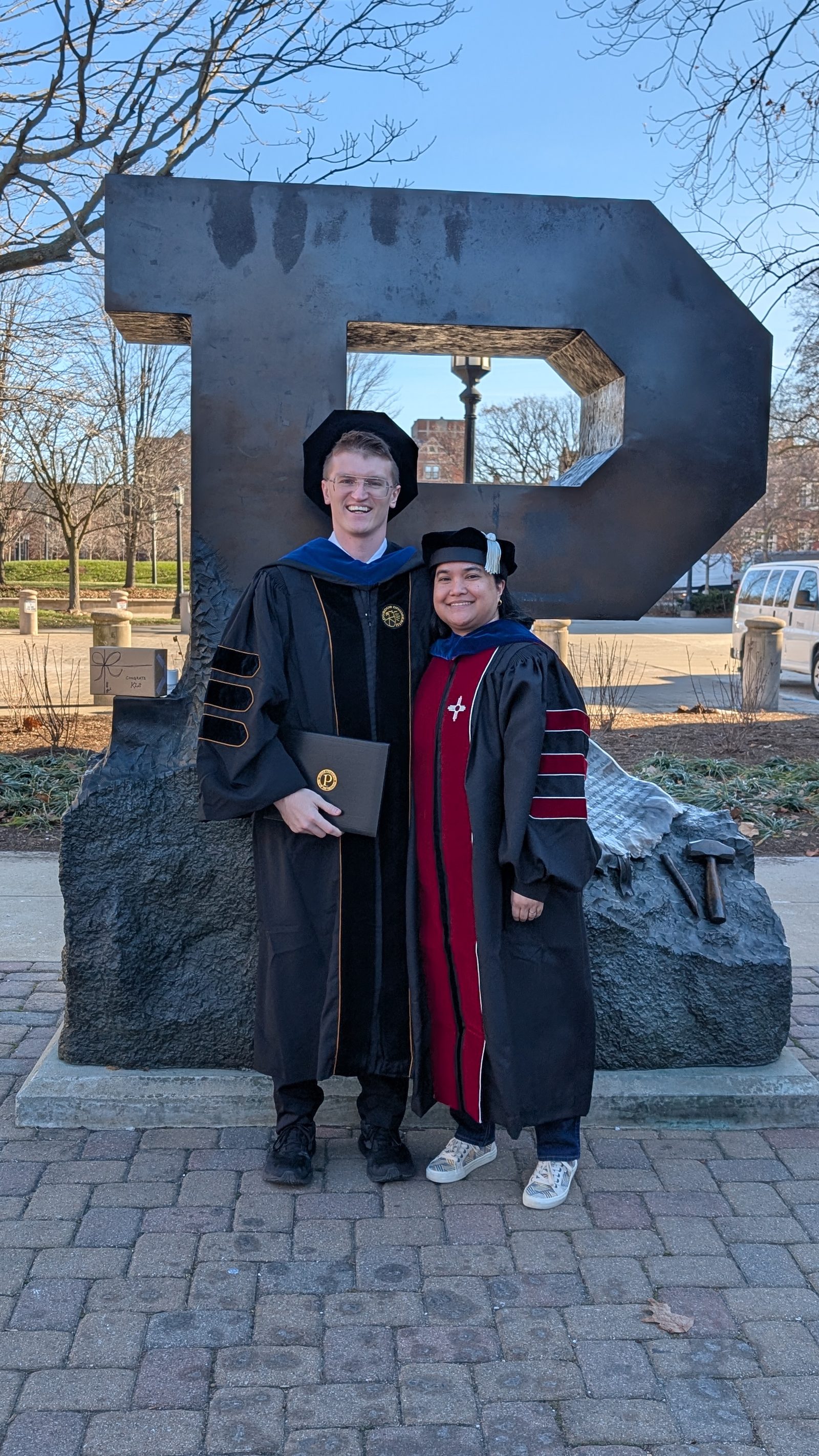 Kevin Scrudders with Dr. Shalini T. Low-Nam at his PhD graduation